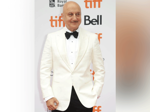 Anupam Kher poses at a Tiff event  