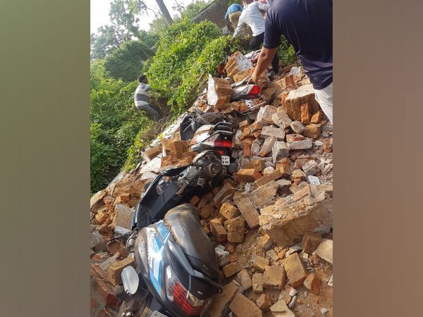 Several bikes were damaged after a rice mill wall collapses in Dhenkanal on Sunday. [Photo/ANI]