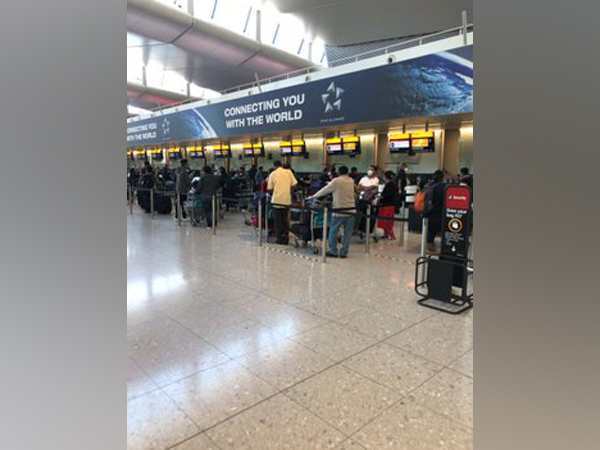 Stranded Indian at a London airport before boarding the flight for Kochi on Tuesday.