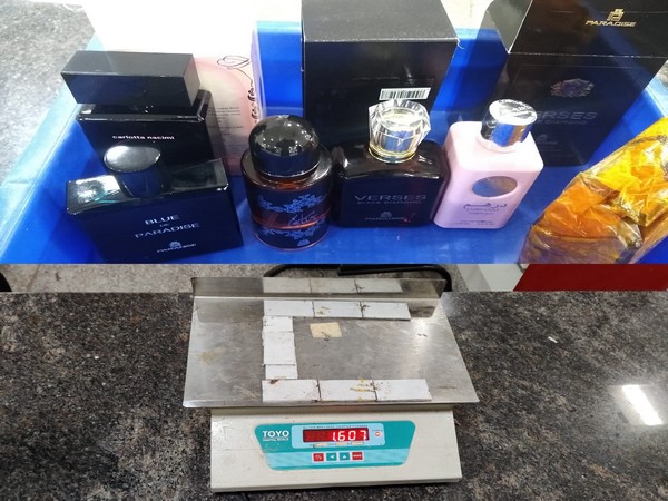 Gold seised from perfume bottles and a battery case at Kozhikode International Airport. 