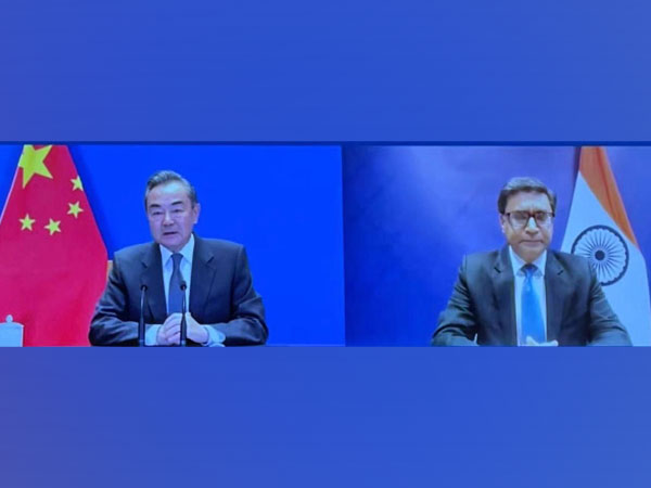 Chinese Foreign Minister Wang Yi and Indian Ambassador to Beijing Vikram Misri