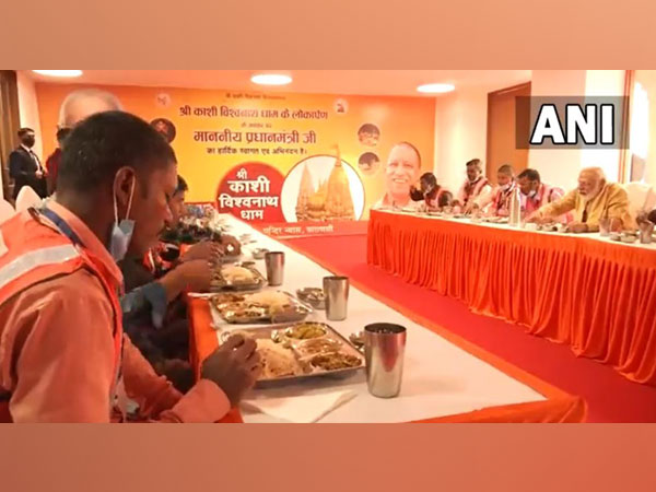 PM Modi, CM Yogi Adityanath have lunch with workers involved in construction work of Kashi Vishwanath Dham Corridor (Photo/ANI)
