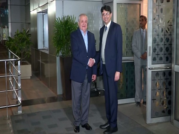 Uzbek Foreign Minister Abdulaziz Kamilov (L) arrives in New Delhi