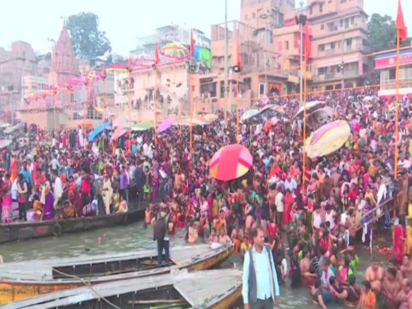 Hundreds of devotees took holy dip at Dashashwamedh Ghat on banks of river Ganga in Varanasi on Tuesday