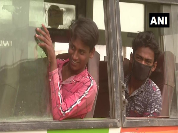 Passengers onboard buses at Varanasi. Photo/ANI