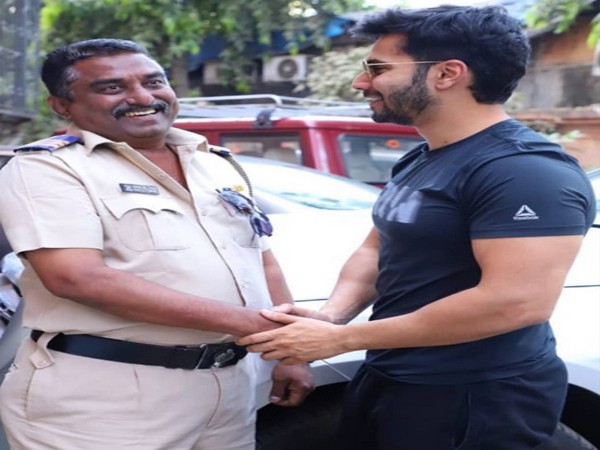 Actor Varun Dhawan with a police officer (Image Source: Instagram)
