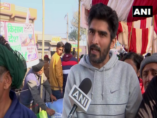 Boxer and Congress leader, Vijender Singh talking to ANI at Tikri Border on Friday. (Photo/ANI)