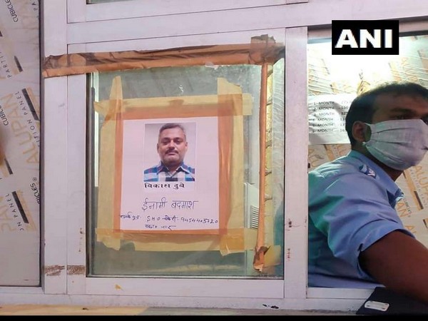 Photographs of history-sheeter Vikas Dubey, the main accused in Kanpur encounter case, have been put up at Unnao toll plaza.