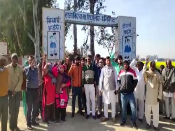 Villagers protesting outside the school in Dhankot, Gurugram on Friday. Photo/ANI