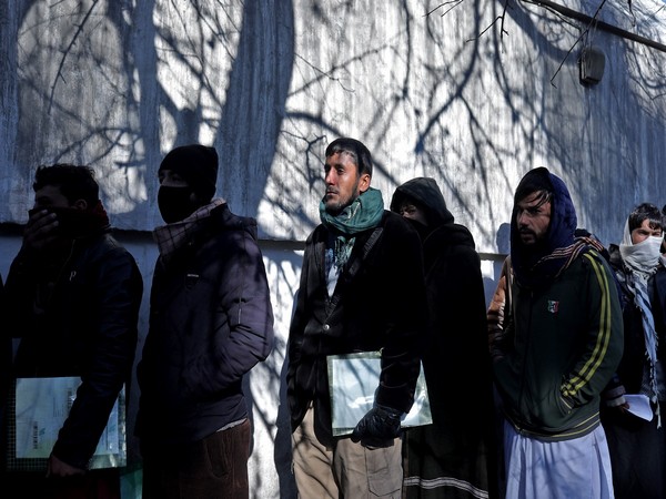 Afghans stand in queue as they wait to get their visa. (Photo Credit - Reuters)