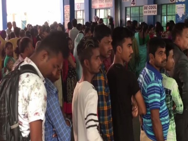 Patients waiting in long queues at North Bengal Medical College and Hospital on Monday.