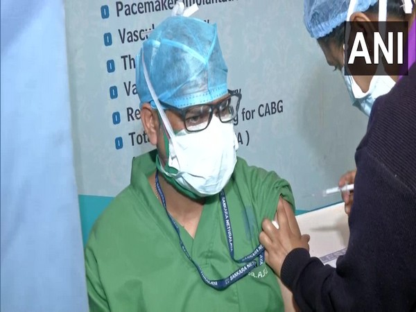 A healthcare worker taking 'precautionary dose' in Peerless hospital. (ANI/photo)