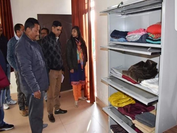 Officials at the Clothes bank opened in District Headquarters Chamoli, Uttarakhand on Tuesday. Photo/ANI