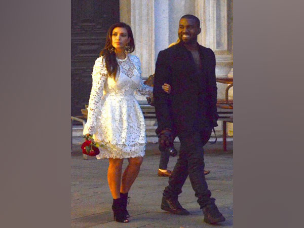 American rapper Kanye West (R) and wife Kim Kardashian (L) (File photo)