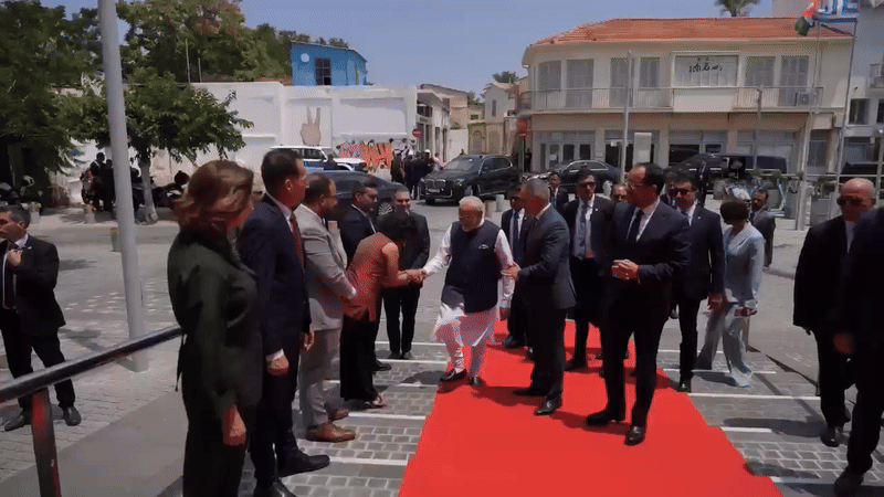 Cyprus council member Michaela Kythreoti Mhlapa touches PM Modi’s feet (Photo/ ANI)