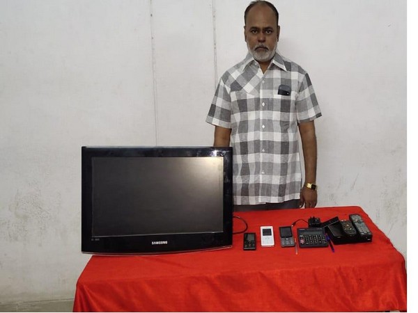 Accused Venkatesh Parashar  with the recovered items in Hyderabad on Monday. (Photo/ANI)