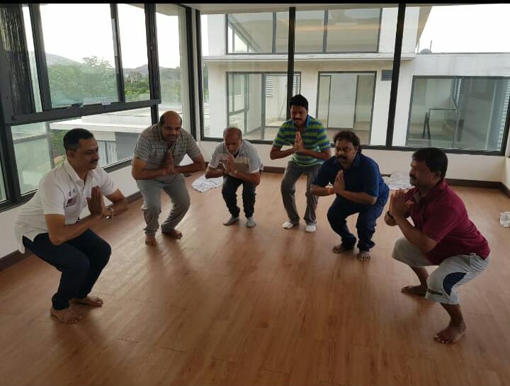 JD(S) MLAs performing yoga at the Prestige Golfshire Club  on Wednesday. Photo/ANI