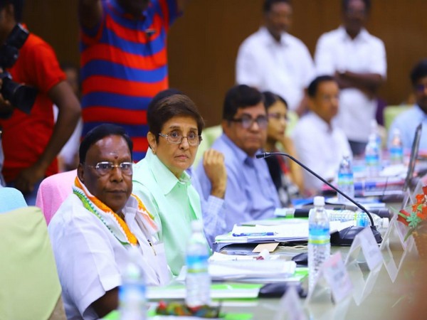 Chief Minister V Narayanasamy and Lieutenant Governor Kiran Bedi at a meeting in Puducherry on Saturday. 