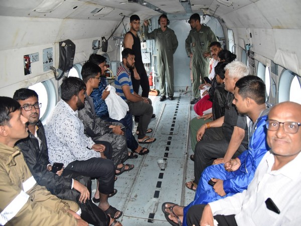 People rescued from flood-affected areas onboard IAF helicopter.