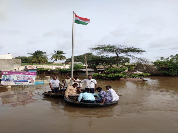 Shurpali villagers hoist national flag in floodwater in Karnataka