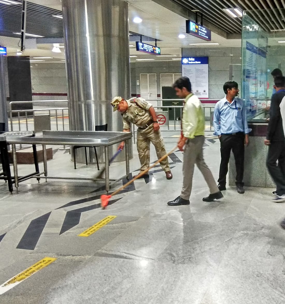 DMRC and CISF staff cleaning a metro station in New Delhi on Wednesday. Photo/ANI