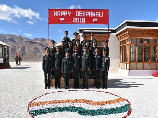 Indian and Chinese army personnel during a meeting on the occasion of Diwali in eastern Ladakh on Saturday.