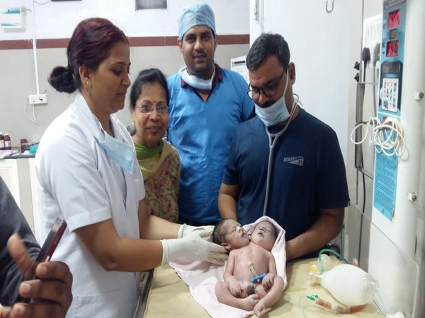 Hospital staff with the newborn