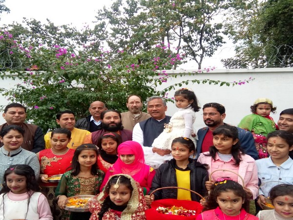 CM Rawat celebrating the Phool Dei festival at his residence in Dehradun on Saturday. Photo/ANI