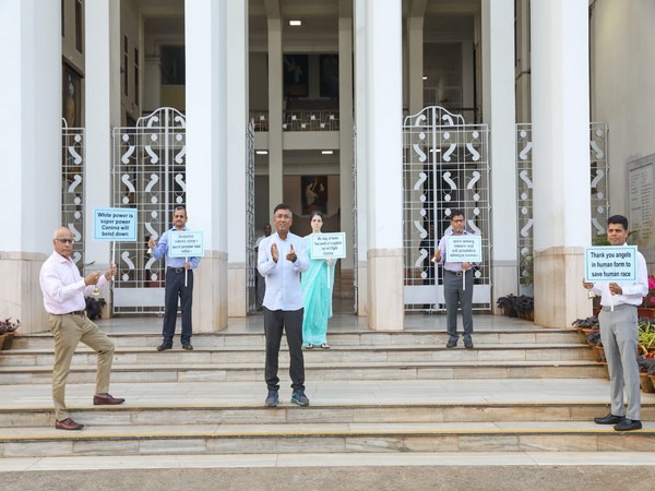 Odisha bureaucrats clapping outside the state secretariat on Sunday. Photo/ANI