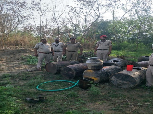 Rupnagar Police with the seized illicit liquor on Friday. Photo/ANI