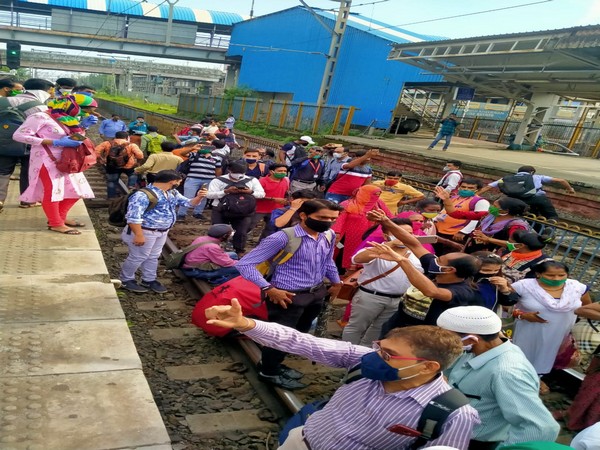 Protesters on railway tracks at Nalasopara Railway Station (Photo/ANI)