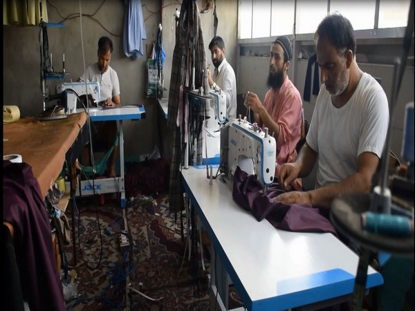 Workers stitching in a factory in Pulwama, J-K. [Photo/ANI]