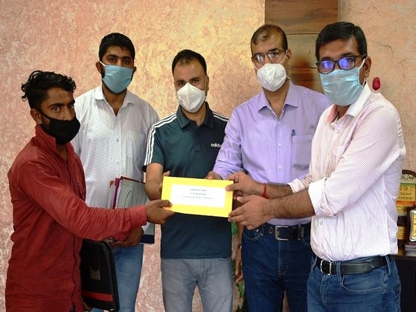 District Commissioner of Poonch Rahul Yadav handed over the appointment orders to the family members 3 died in border shelling. (Photo/ANI)