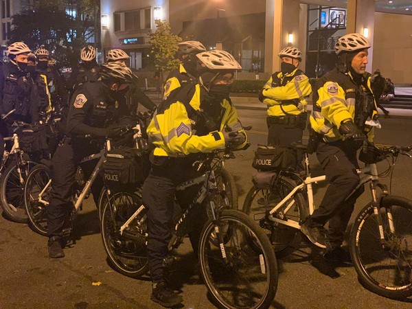 Demonstrations were largely peaceful aside from two scuffles in which police say three people have been arrested.