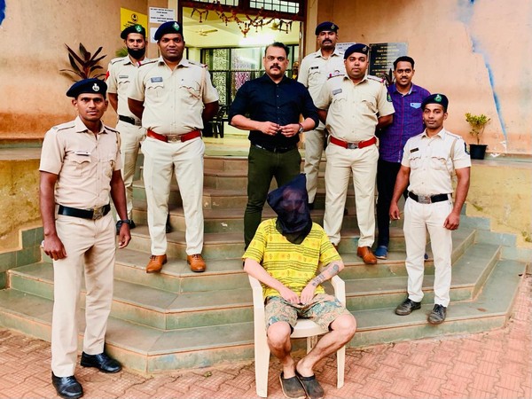 Goa police with the arrested Russian national on Tuesday. (Photo/ANI)