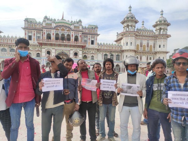 A group of people staging a demonstration against Pakistan's role in terrorism.