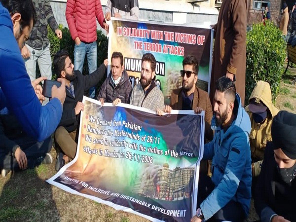 Several citizens at a sit-in protest in Jammu and Kashmir against Pakistan's role in 26/11 Mumbai attacks.