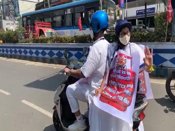 Mamata Banerjee rode pillion on an electric scooter to state secretariat Nabanna from her residence at Kalighat in Kolkata.