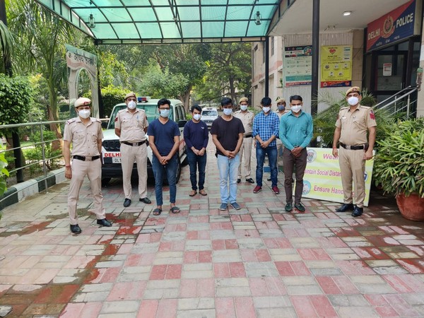 Malviya Nagar police with the five arrested people (Photo/ANI)