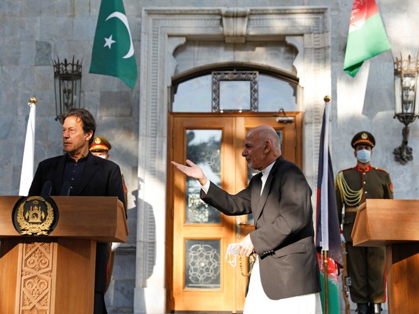 Afghan President Ashraf Ghani leaves after a joint news conference with Pakistan's Prime Minister Imran Khan at the presidential palace in Kabul. 
