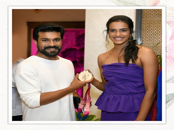 Ram Charan with PV Sindhu at the event