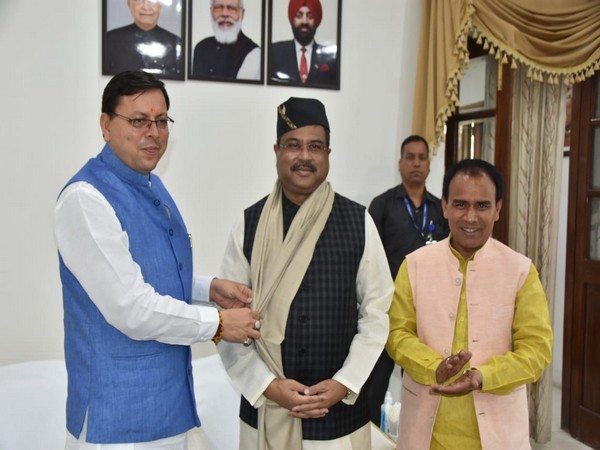 Uttarakhand CM Pushkar Singh Dhami with Union Education Minister Dharmendra Pradhan. (Phoot/ANI)