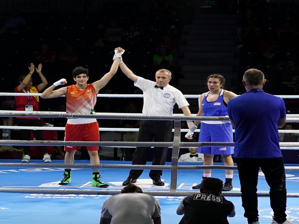 Parveen (In red) after winning pre-quarters in Women's World Boxing Championships