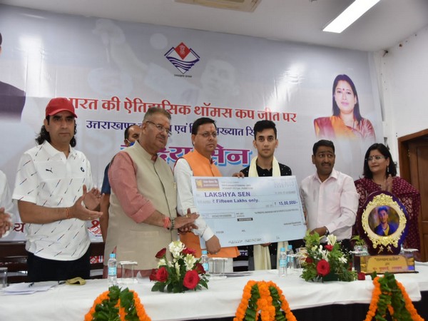Uttarakhand Chief Minister Pushkar Singh Dhami honouring shuttler Lakshya Sen