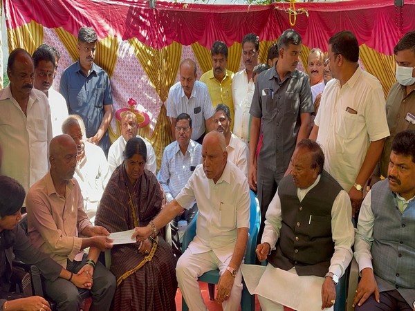 Former Karnataka CM BS Yediyurappa iwth Harsha's family. (Photo/ANI)