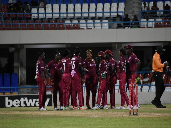 West Indies women gathered in the middle after taking a wicket. (Photo/Windies Cricket Twitter)