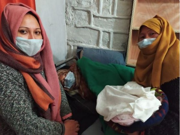 The ASHA worker with the woman who had a normal delivery in Kargil. Photo/ANI