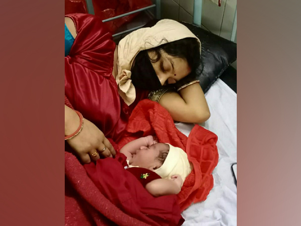 The woman with her child at the Rural Hospital in Igatpuri. (Photo/ANI)