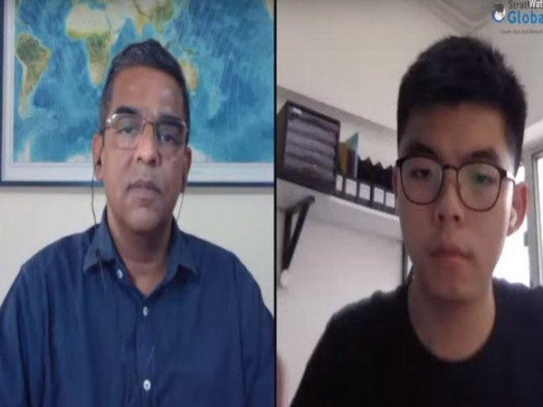 Nitin A Gokhale, Editor-in-Chief of Strategic News International (SNI) with Hong Kong pro-democracy activist Joshua Wong. (Photo credit: SNI)