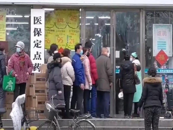 People in Wuhan lining up at drug store 